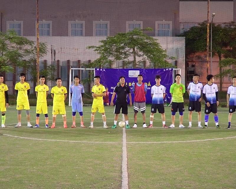 A group of people standing on a football field