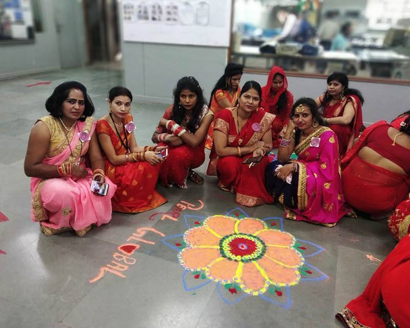 A group of women sitting on the floor