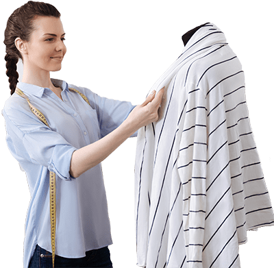 Apparel professional reviewing a garment on a mannequin as part of the design and fitting process